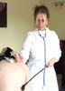 Mistress Kazy Kane in doctor mode whips naughty patient on bare backside E